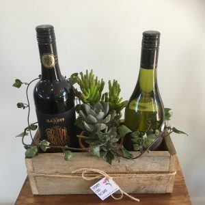 2 wines and plant or flowers
